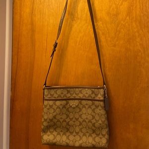 Brown Coach crossbody purse with adjustable strap